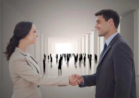 Handshake in corridor with silhouettes Stock Photos