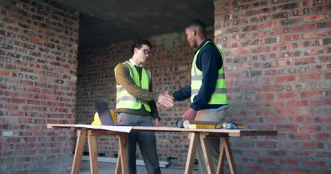 Handshake, discussion and construction workers on site with partnership, Stock Footage 337016845