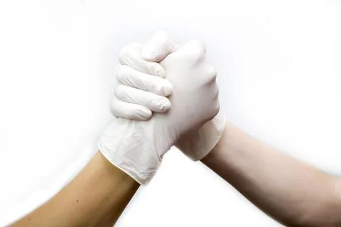 A handshake of doctors on a white background. Stock Photos