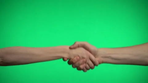 Handshake on a green background. Video stock 163600075
