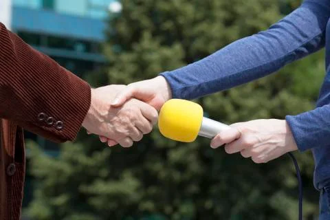 Handshake before media interview Stock Photos