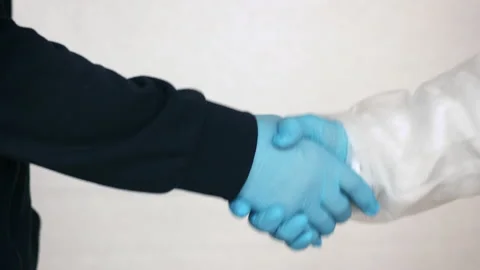 Handshake in Medical Gloves Vidéo 143063944