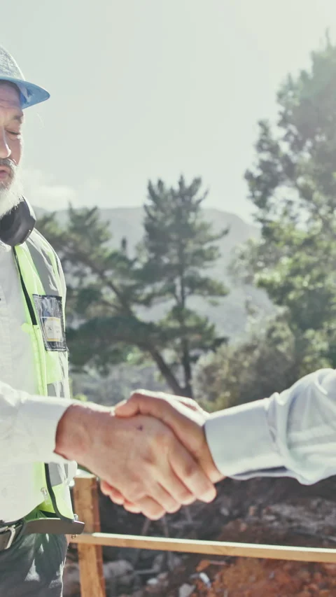 Handshake, men and construction workers on site with partnership for building Stock Footage 340450779