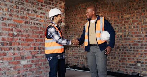 Handshake, men and construction workers on site with deal, agreement or 스톡 사진
