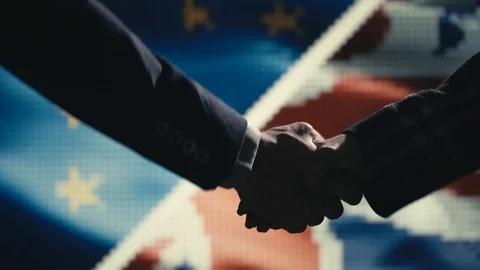 Handshake. Multiple takes. EU and Great Britain flag on LED background. Stock Footage 85690667