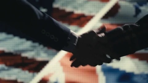Handshake. Multiple takes. US and Great Britain flag on LED background. Video stock 85690703