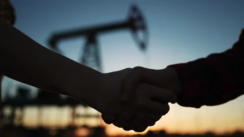 Handshake oil contract. handshake a worker and businessman shaking hands against Video stock 213535307