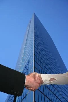 Handshake with tall skyscraper Stock Illustration