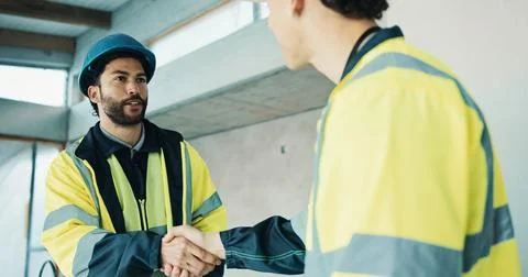 Handshake, teamwork and construction workers at worksite for partnership Stock Photos