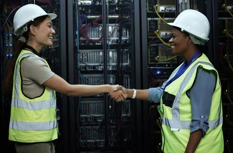 Handshake, women and data programmer as engineer in computer center for teamwork Stock Photos