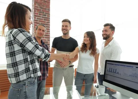 Handshake young designer and the client Stock Photos