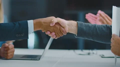 Handshaking over desk in office Stock Footage 168277013