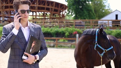 Handsme men standing in a ranch Stock Footage 118012839
