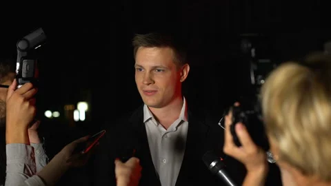 Handsome actor giving interview on press... | Stock Video | Pond5