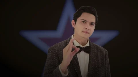 Handsome actor with a glowing star in the background. 4K ProRes Stock Footage 160514792