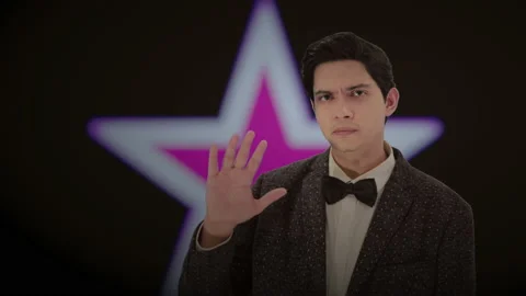 Handsome actor with a glowing star in the background. 4K ProRes Stock Footage 160514808
