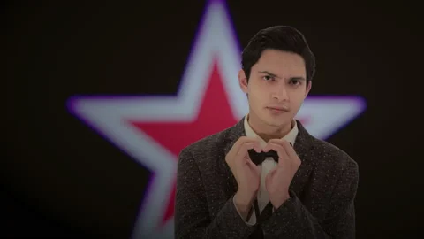 Handsome actor with a glowing star in the background. 4K ProRes Stock Footage 160514832