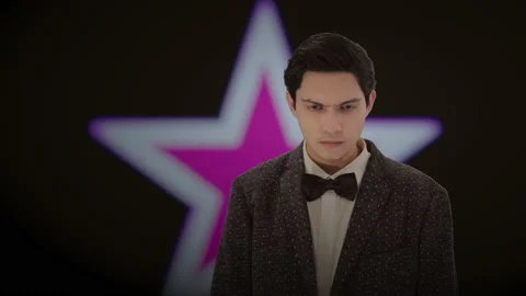 Handsome actor with a glowing star in the background. 4K ProRes Stock Footage 160514835