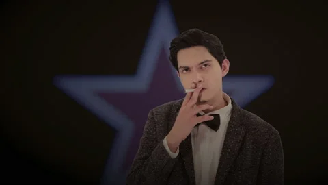 Handsome actor with a glowing star in the background. 4K ProRes Stock Footage 160514908