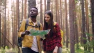 Handsome African American Man Is Holding Map And Looking Around While His Female Stock Footage