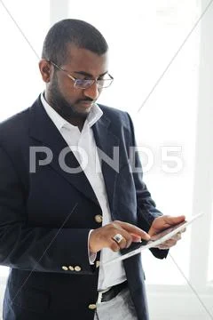 Handsome african american man with tablet computer Stock Photos