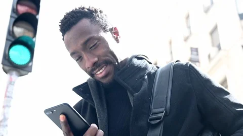 Handsome African American man using smartphone. Video stock 126527455