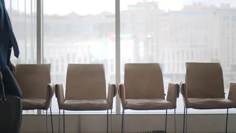 Handsome african man checking time while waiting for job interview Stock Footage 137325467