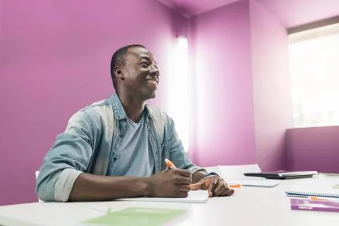 Handsome african man learning at classroom. Stock Photos
