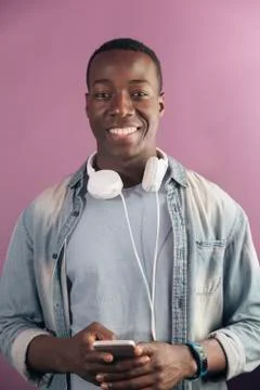 Handsome african man using mobile. Stock Photos