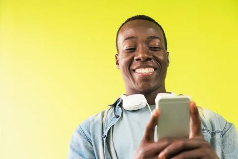 Handsome african man using mobile. Stock Photos