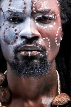 Handsome afro american guy with authentic chain on neck look at camera Stock Photos
