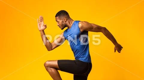Handsome Afro Sportsman Walks Highly Lifting Knees