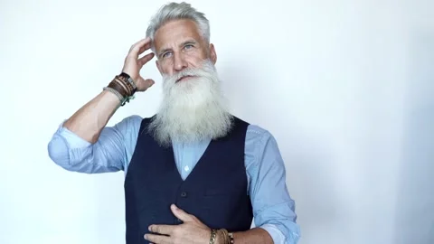 Handsome aged male model posing on white background Stock Footage 233632521
