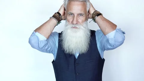 Handsome aged male model posing on white background Stock Footage 233655147