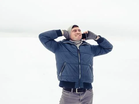 Handsome and happy guy with mobile phone Stock Photos