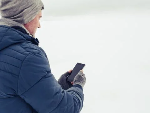 Handsome and happy guy with mobile phone Stock Photos