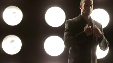 Handsome and stylish man in front of a wall of lights Video stock 142188755