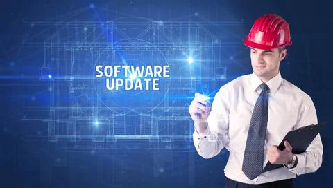 Handsome architect drawing with helmet Stock Photos