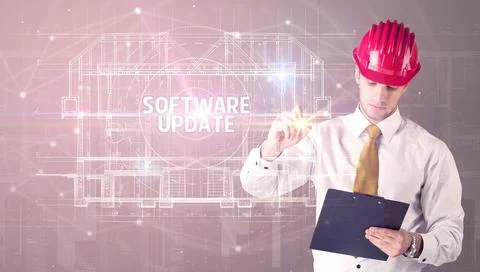 Handsome architect drawing with helmet Stock Photos