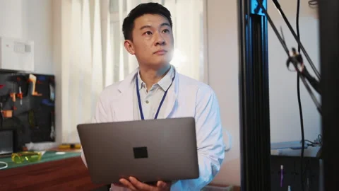 Handsome asian developer guy with computer laptop entering data cloud computing Stock Footage 153744665