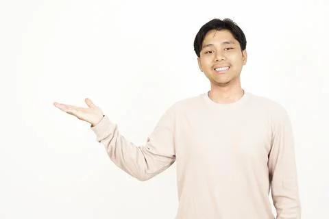 Handsome Asian Guy Presenting Empty Palm to Side Stock Photos