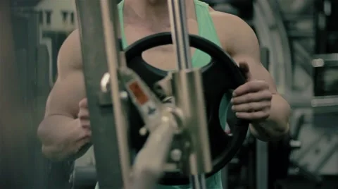 Handsome athletic man hangs weight on the press bench to do sport exercize for p Stock Footage 63217757