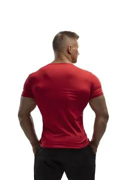 Handsome athletic man posing in a T-shirt on a white background Stock Photos
