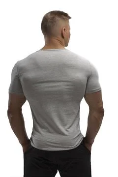 Handsome athletic man posing in T-shirt on a white background Stock Photos