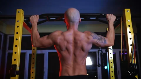 Handsome athletic man on strict diet training pumping up back muscles Stock Footage 147663449