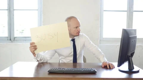 Handsome attractive caucasian worker with work related cardboard signs messages: Video stock 143438385