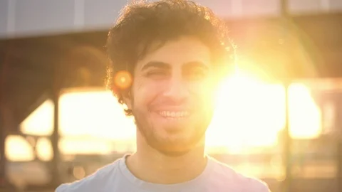 Handsome attractive eastern man with beard laughing on camera, atsunset, close Stock Footage 109458049