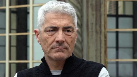 Handsome attractive middle aged man outdoor portrait: pensive worried man Stock Footage 74684130