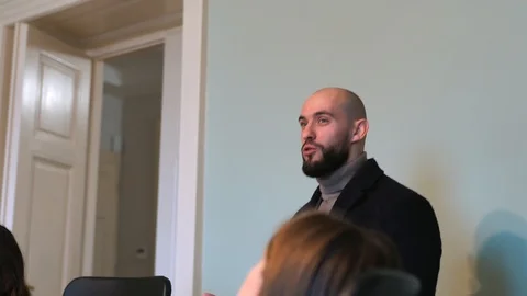 Handsome bald man with beard making speech, 4K 動画素材 124717792