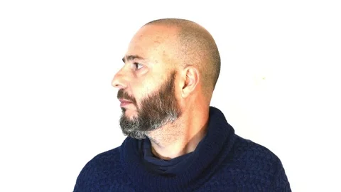 Handsome, bald man with beard on white background Stock Footage 72748391